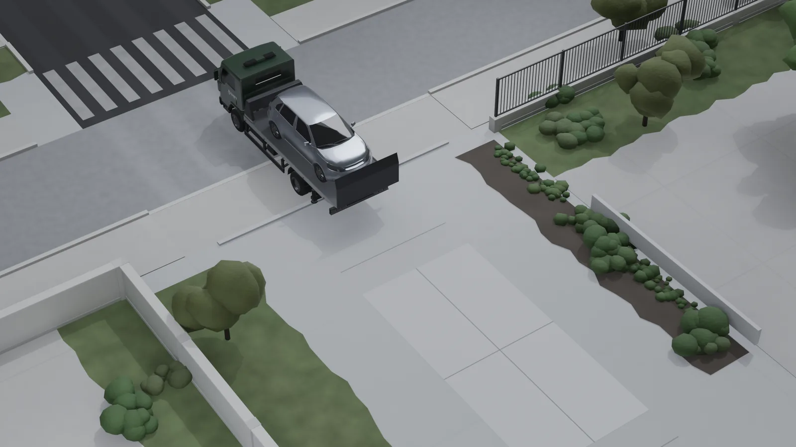 Guincho parado na rua com o hatchback já carregado sobre a plataforma.